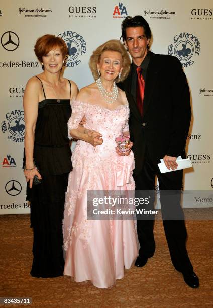 Actress Frances Fisher, Barbara Fisher and singer Jimmy Demers pose during the cocktail reception at the 30th anniversary Carousel of Hope Ball to...