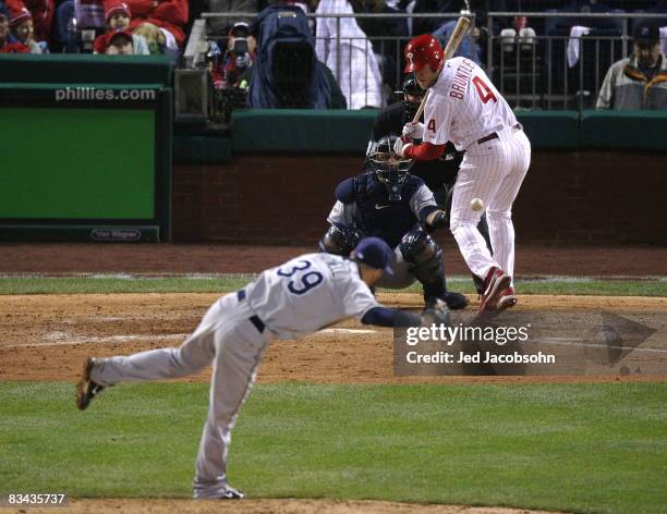 Grant Balfour of the Tampa Bay Rays hits Eric Bruntlett of the Philadelphia Phillies with a pitch during game three of the 2008 MLB World Series on...