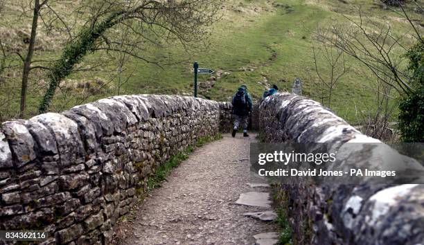 The footbridge at Milldale over the river Dove in Dovedale in the Derbyshire Peak District.