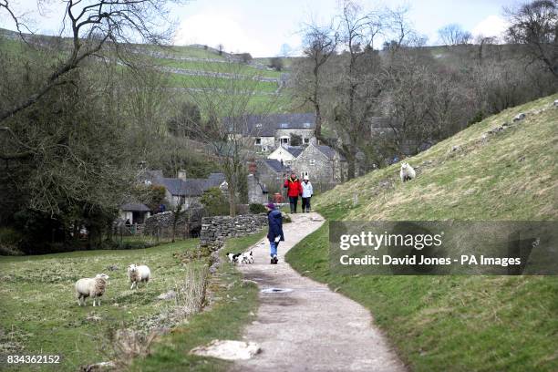 The footpath towards the hamlet of Milldale, beside the river Dove in Dovedale in the Derbyshire Peak District.