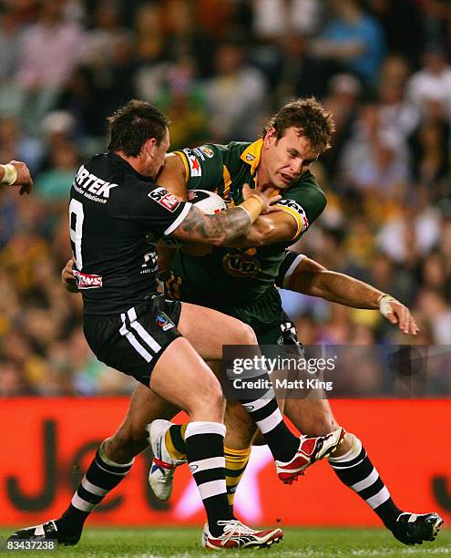 Josh Perry of the Kangaroos is tackled during the Rugby League World Cup Pool 1 match between the Australian Kangaroos and the New Zealand Kiwis at...