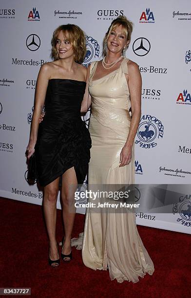 Melanie Griffith and daughter Dakota Johnson arrive at The 30th Anniversary Carousel Of Hope Ball at The Beverly Hilton Hotel on October 25, 2008 in...