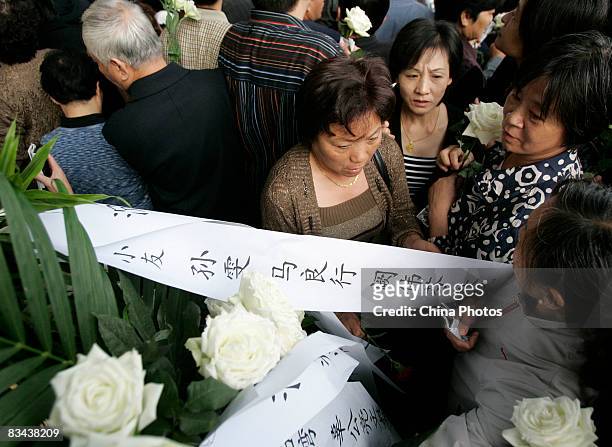 People attend the funeral of the famed Chinese film director Xie Jin at the Longhua Funeral Home on October 26, 2008 in Shanghai, China. Xie was born...