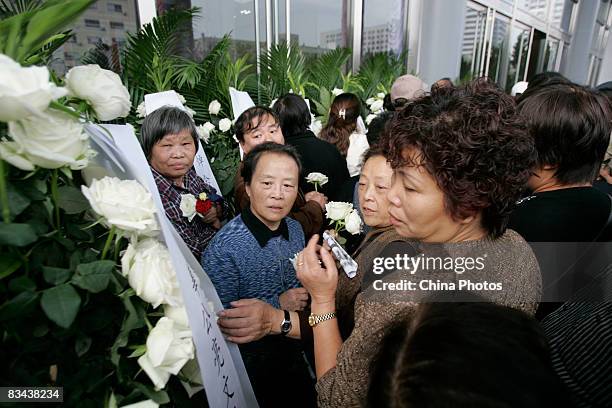 People attend the funeral of the famed Chinese film director Xie Jin at the Longhua Funeral Home on October 26, 2008 in Shanghai, China. Xie was born...