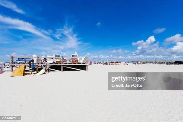 beach of st. peter-ording in germany during summer time - st peter ording stock pictures, royalty-free photos & images