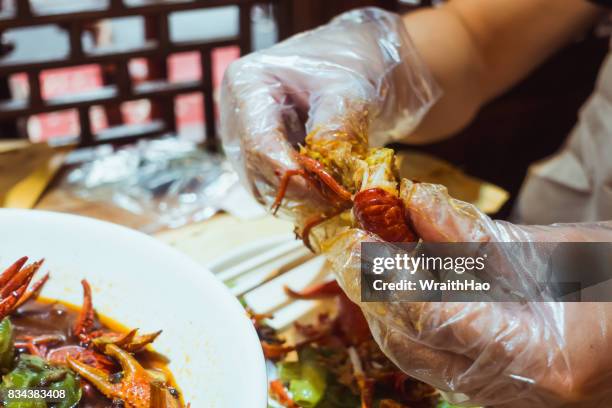 crawfish boiling - glove stock pictures, royalty-free photos & images