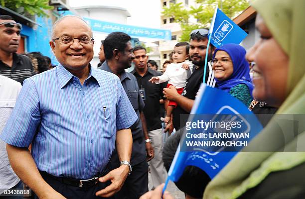 Maldives president and Dhivehi Rahyithunge Party's presidential candidate Maumoon Abdul Gayoom greets supporters as he takes part in an electoral...