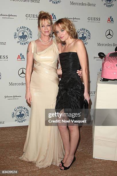 Melanie Griffith and her daughter Dakota Johnson attend the VIP Reception of The 30th Anniversary Carousel Of Hope Ball at The Beverly Hilton Hotel...