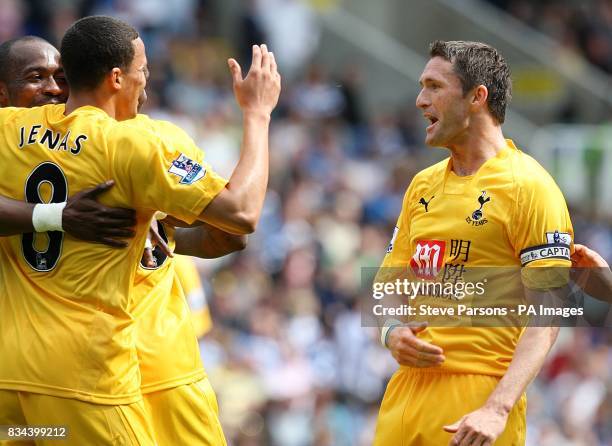 Tottenham Hotspur's Robbie Keane celebrates with his team mates after scoring the opening goal of the game.