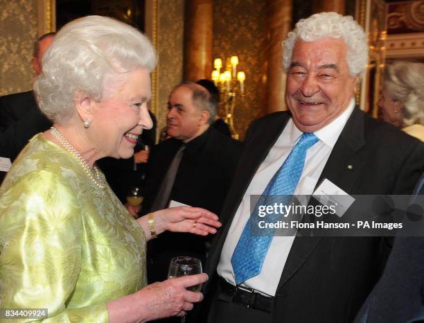 Britain's Queen Elizabeth II chats with celebrity chef Antonio Carluccio during a reception she hosted for the British Hospitality Industry at...