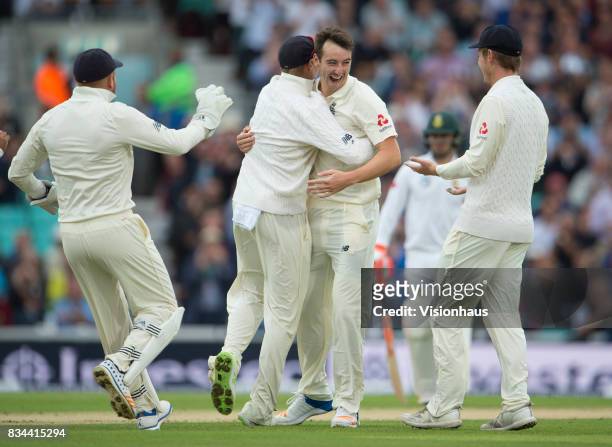 Toby Roland-Jones of England celebrates taking the wicket of Dean Elgar during day two of the 3rd Investec test between England and South Africa at...