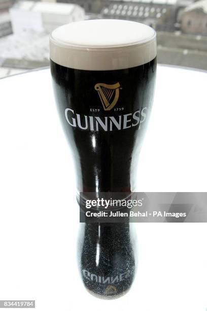 Pint of Guinness, on a table, in the Gravity bar at the Guinness storehouse, Dublin.