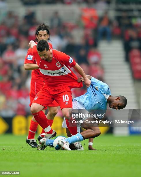 Manchester City's Fernandes Gelson and Middlesbrough's Fabio Rochemback battle for the ball
