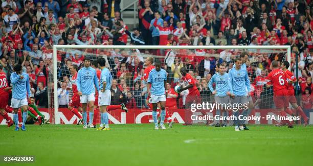 Manchester City players dejected after Middlesbrough's Fabio Rochemback scores his sides sixth goal of the game from a free kick