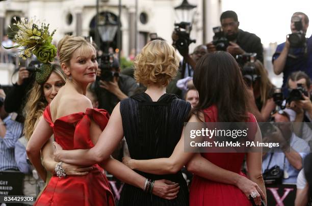 Sarah Jessica Parker, Kim Cattrall, Cynthia Nixon and Kristin Davis pose for photographers as they arrive for the world premiere of Sex and the City...