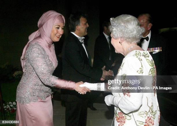 Britain's Queen Elizabeth II is welcomed by President Abdullah Gul's wife Hayrunnisa Gul as she arrives at the Presidential Palace for a State...