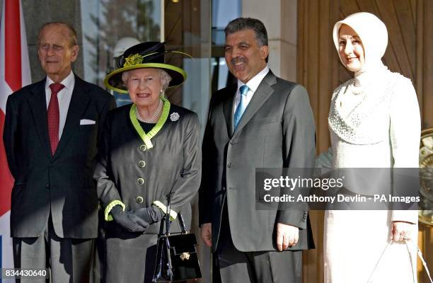 Britain's Queen Elizabeth II attends a welcoming ceremony at the Presidential Palace with the Duke of Edinburgh, President Abdullah Gul and Harunnisa...