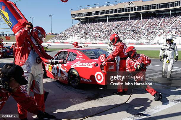 Reed Sorenson driver of the Lysol/Target Dodge makes a pit stop during the NASCAR Sprint Cup Series Pep Boys Auto 500 at Atlanta Motor Speedway on...