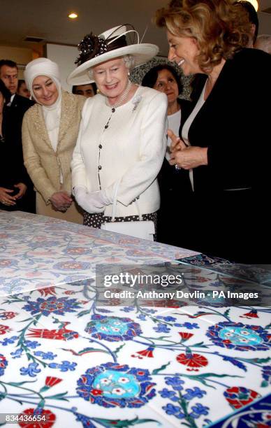 Britain's Queen Elizabeth II visits an Iznik tile exhibition with the wife of President Abdullah Gul, Hayrunnisa Gul , following a visit to a local...