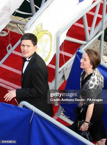 Foreign Secretary David Miliband and wife arrive for a cocktail party hosted by Britain's Queen in honour of Turkish President Abdullah Gul onboard...