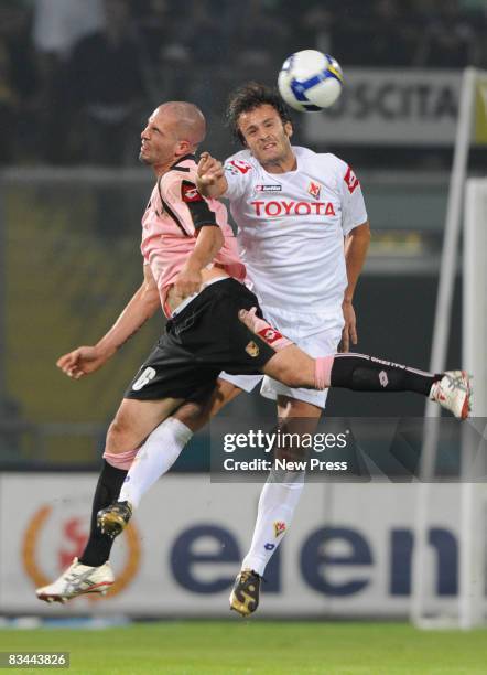 Andrea Raggi of Palermo and Alberto Gilardino of Fiorentina in action during the Serie A match between Palermo and Fiorentina at the Stadio Barbera...