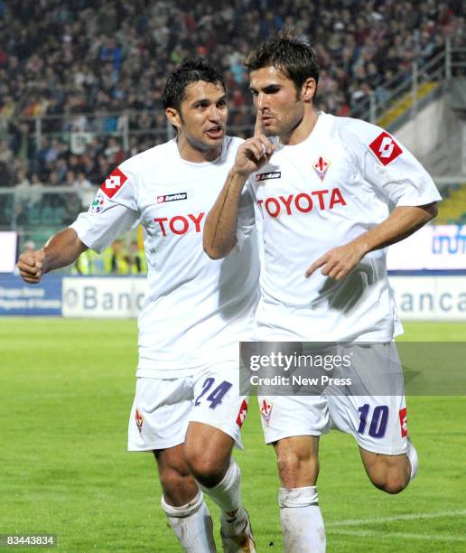Adrian Mutu and Mario Alberto Santana of Fiorentina celebrate during the Serie A match between Palermo and Fiorentina at the Stadio Barbera on...