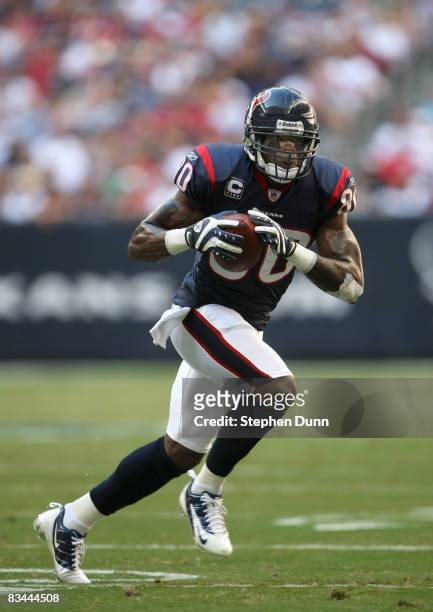 Wide receiver Andre Johnson of the Houston Texans carries the ball against the Cincinnati Bengals on October 26, 2008 at Reliant Stadium in Houston,...