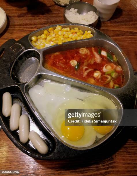 korean barbeque's side dish containing egg, corn, rice cake - barbeque sauce imagens e fotografias de stock
