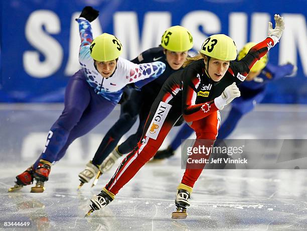 Marianne St-Gelais of Canada skates to a first place finish during her 500m quarterfinal heat in front of Katerina Novotna of the Czech Republic and...