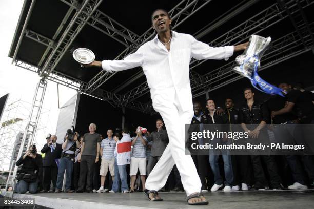 Winning Portsmouth goalscorer Nwankwo Kanu dances with FA Cup onstage during a parade in Portsmouth.