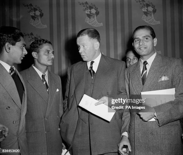 Freddie Brown, Northants and England, centre, chatting to India test cricket team captain Vijay Hazare, second left.