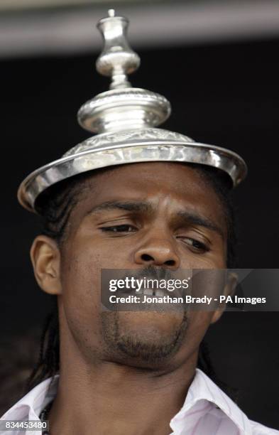 Winning Portsmouth goalscorer Nwankwo Kanu dances with FA Cup onstage during a parade in Portsmouth.