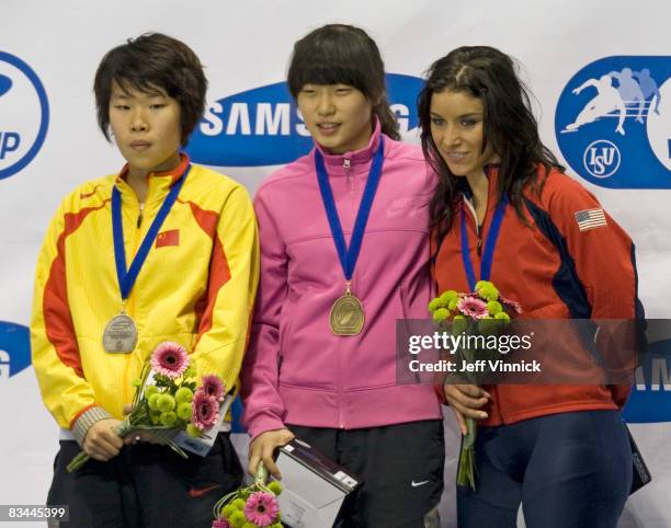 Shin Sae-Bom of South Korea is surrounded by Zhou Yang of China and Allison Baver of the United States during medal ceremony for the women's 1000m...