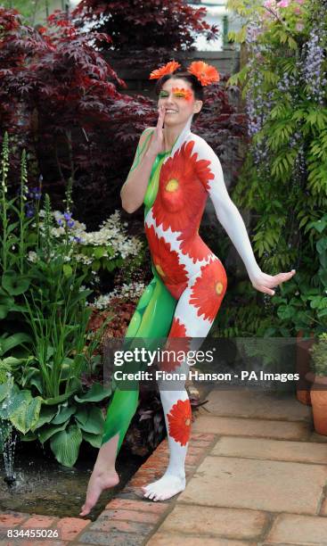 Model Suzi Taylor's body is painted symbolising the twin themes of sustainability and adaptability in the Real life by Brett Garden at the Chelsea...