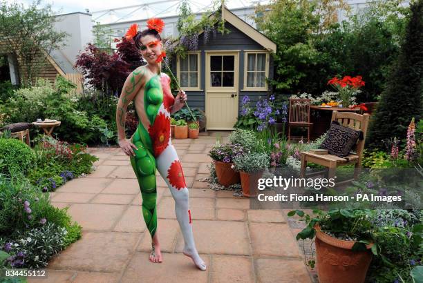 Model Suzi Taylor's body is painted symbolising the twin themes of sustainability and adaptability in the Real life by Brett Garden at the Chelsea...