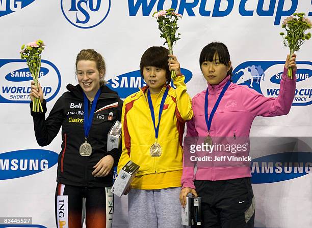 Marianne St-Gelais of Canada celebrates her second-place finish next to winner Wang Meng of China, and bronze medalist Yang Shin-Young of South...