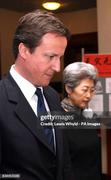 Conservative leader David Cameron with Chinese ambassador Fu Ying at the Chinese Embassy in London, to pay respects to those who died in the Sichuan...