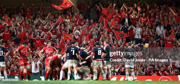 Munster's supporters cheer their team as they run down the clock to defeat Toulouse and win the Heineken Cup at the Millennium Stadium, Cardiff.