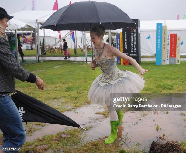 Jenna Lee a ballerina from the English National Ballet takes a break from performing to enjoy weather at the Hay Festival.