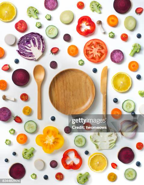 various sliced fruits and vegetables on white background. - blackberry fruit pattern stock pictures, royalty-free photos & images