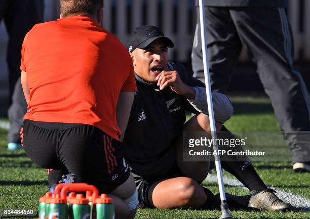 New Zealand Alll Blacks player Aaron Smith chats to teammate Sam Cane during their Captain's Run in Sydney on August 18, 2017. The All Blacks take on...