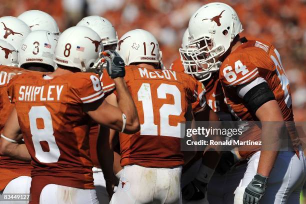 Quarterback Colt McCoy of the Texas Longhorns huddles the offense during play against the Oklahoma State Cowboys at Texas Memorial Stadium on October...
