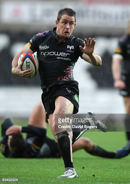 Shane Williams, the Ospreys wing, runs with the ball during the EDF Energy Cup match between Ospreys and Worcester Warriors at the Liberty Stadium on...