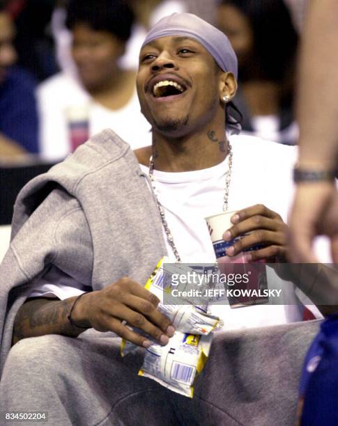 Philadelphia 76ers Allen Iverson enjoys a soda and some potato chips as he watches the third quarter against the Detroit Pistons at the Palace of...