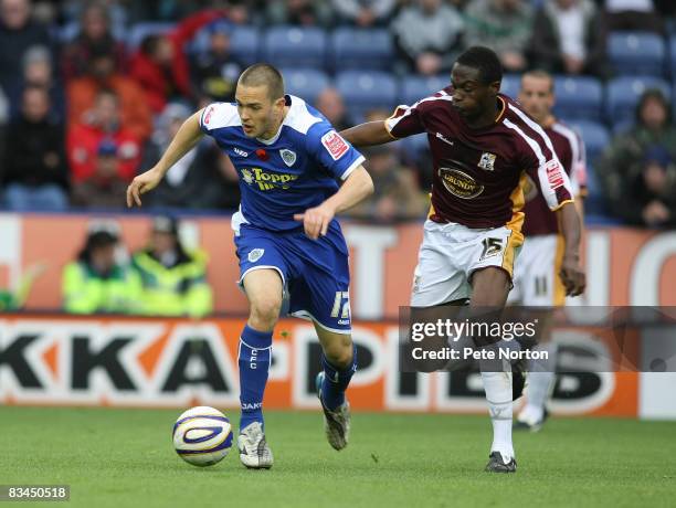 Matty Fryatt of Leicester City moves away from Abdul Osman of Northampton Town during the Coca Cola League One Match between Leicester City and...