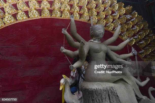 Bangladeshi artist prepares a clay idol of Hindu deity Durga at a workshop ahead of Durga puja festival in Dhaka , Bangladesh on August 18, 2017. The...