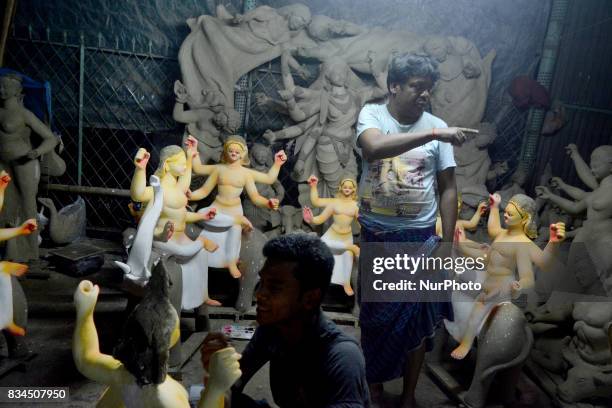 Bangladeshi artists preparing clay idol of Hindu deity Durga and God Biswakarma in Dhaka, Bangladesh on August 18 , 2017 for upcoming Hindu festival...