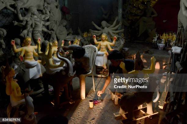 Bangladeshi artists preparing clay idol of Hindu deity Durga and God Biswakarma in Dhaka, Bangladesh on August 18 , 2017 for upcoming Hindu festival...