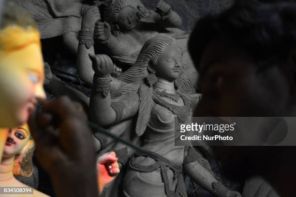 Bangladeshi artist works on an idol of the Hindu God Biswakarma in Dhaka , Bangladesh on August 18, 2017. Biswakarma is the hindu god of architecture...