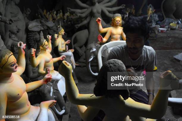 Bangladeshi artist works on an idol of the Hindu God Biswakarma in Dhaka , Bangladesh on August 18, 2017. Biswakarma is the hindu god of architecture...